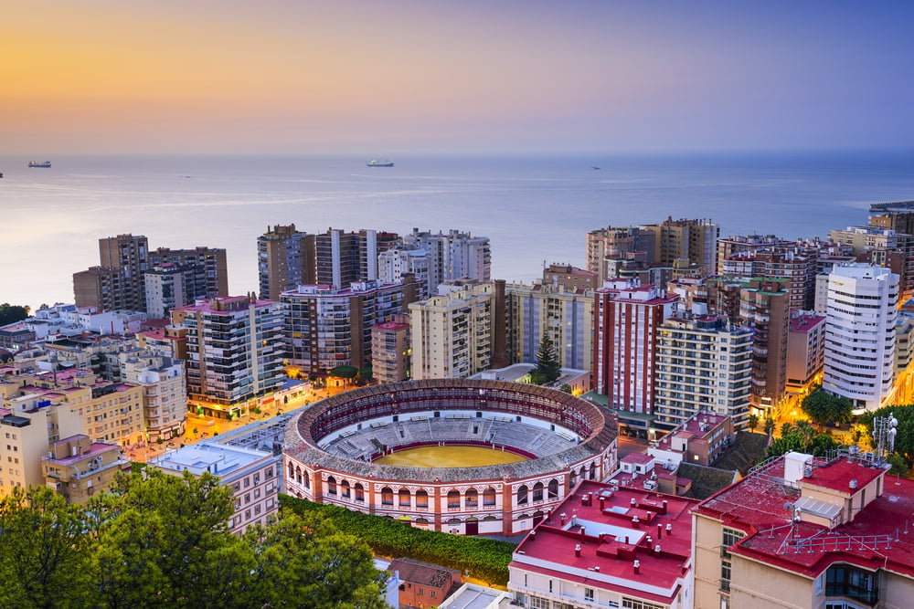 Malaga, Spain cityscape at dawn.